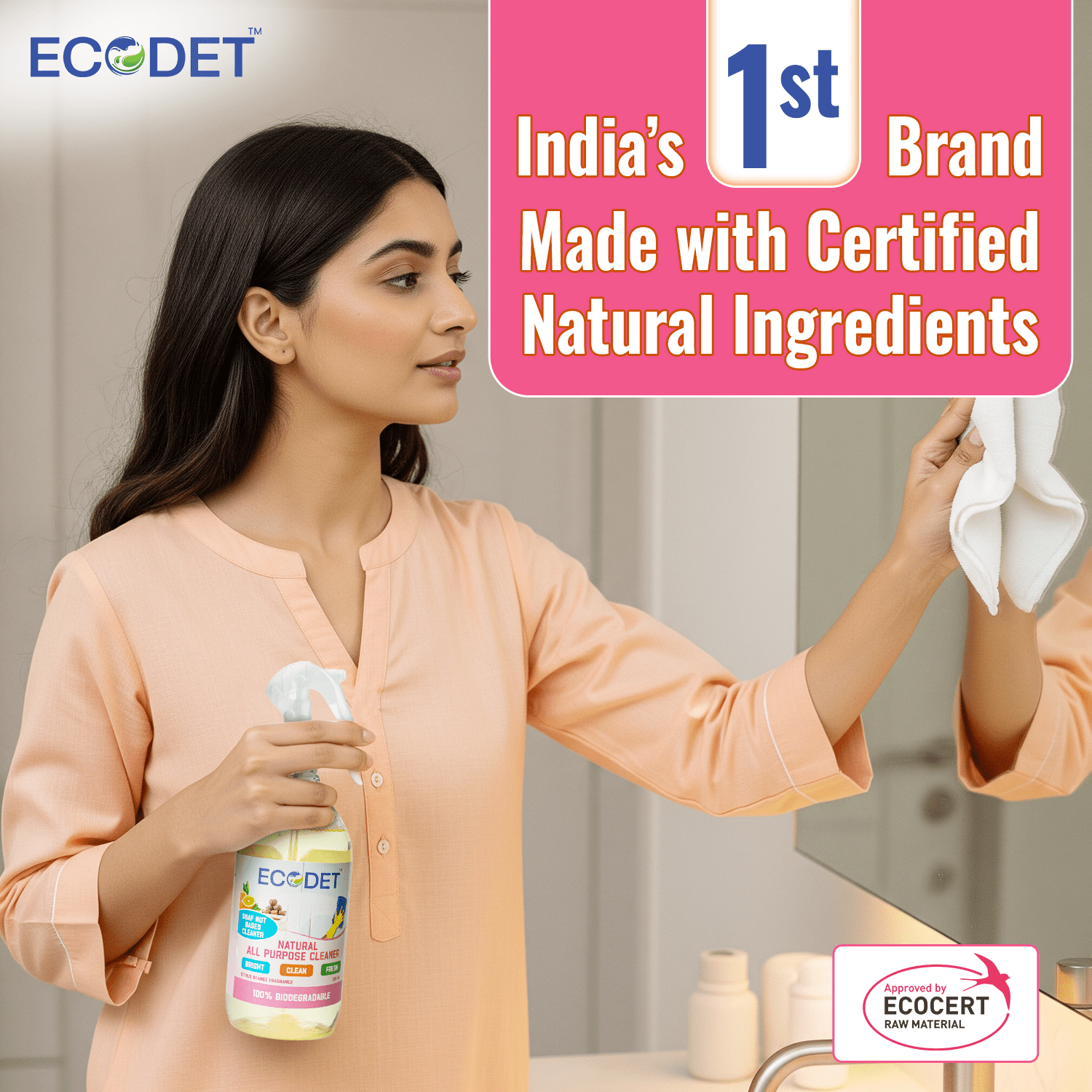 Woman cleaning mirror with Ecodet Natural All Purpose Cleaner Citrus Orange spray bottle in hand